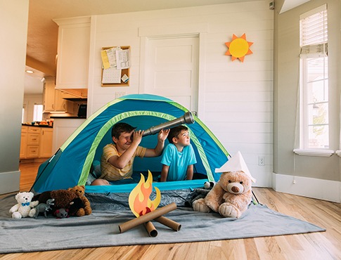 IMAGE: Kids playing in a tent in a living room