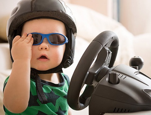 IMAGE: toddler in sunglass and helment