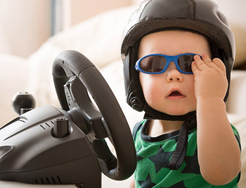 IMAGE: toddler in sunglass and helment