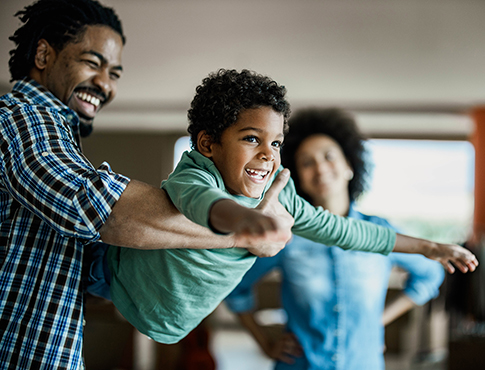 IMAGE: a father playing with his son