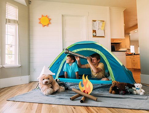 IMAGE: Kids playing in a tent in a living room