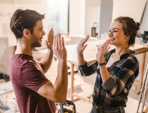 IMAGE: a couple high fiving each other