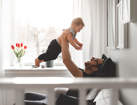 IMAGE: a father playing with his child